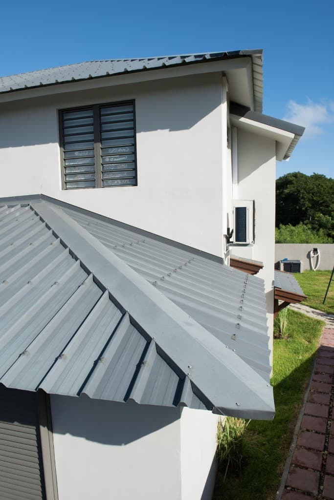 Modern metal roof and specialty roofing system on a South Florida home