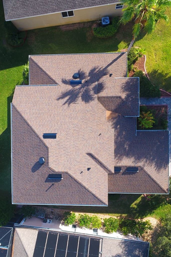 Bird's-eye view of a complex residential roof with architectural shingles